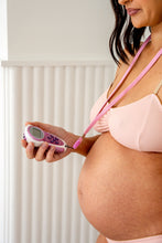 Load image into Gallery viewer, Pregnancy woman with TENS machine on lanyard
